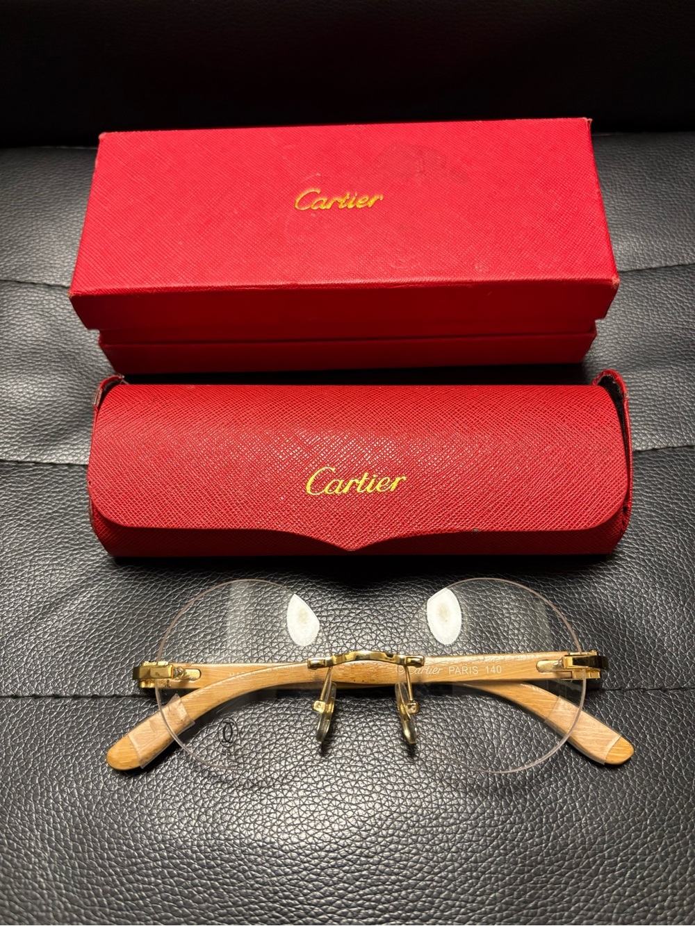 Cartier Rimless Men's Glasses with Gold Accents and Wooden Temples